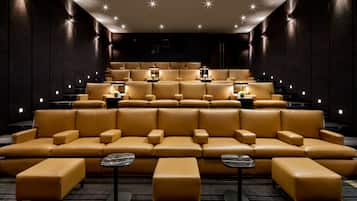 A theater with tiered seating and a central stage.