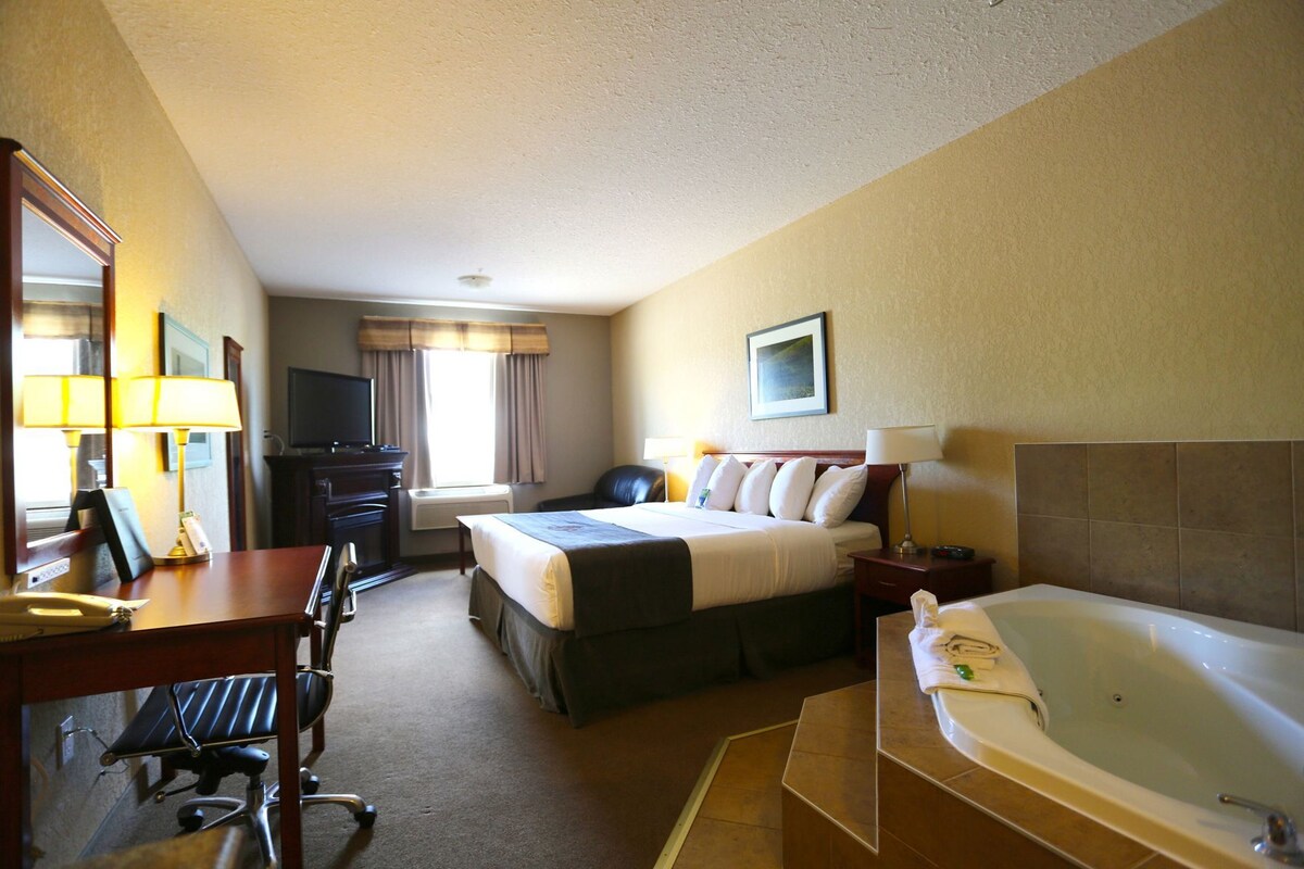 Premium bedding, laptop workspace, blackout drapes, iron/ironing board
