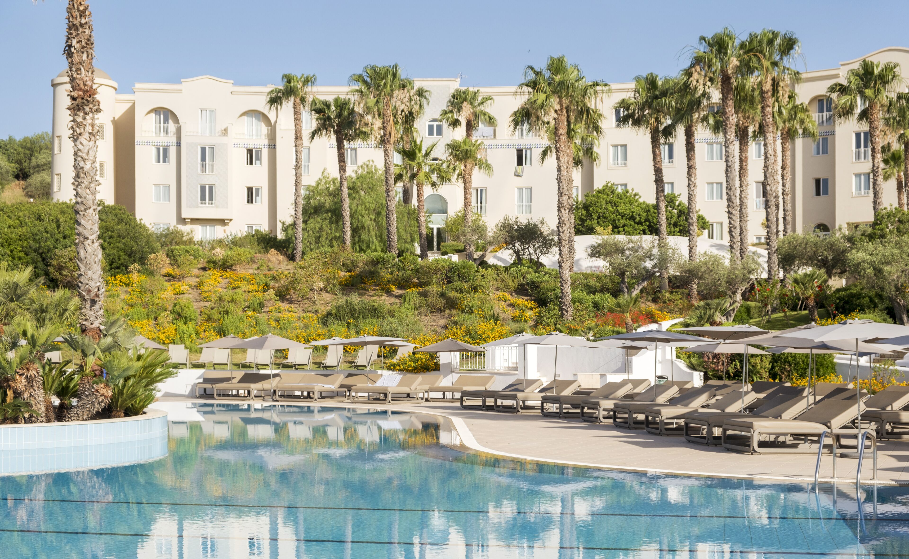 seasonal outdoor pool, pool umbrellas, pool loungers