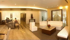 Relax in our spacious lobby, featuring a comfortable seating area, attentive reception, and a view of the outdoors.