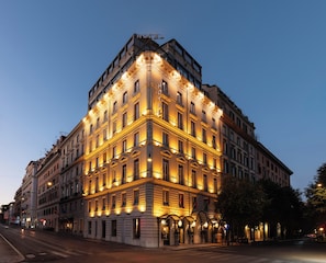 A large, historic hotel with multiple floors and a prominent corner entrance. - ROMANICO PALACE LUXURY HOTEL & SPA (Rome)