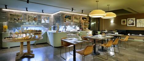 A modern restaurant with a central bar area, multiple dining tables, and a variety of seating options.