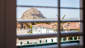A view through a window of a building with a mountain in the background. - The Landing at Morro Bay (Morro Bay)