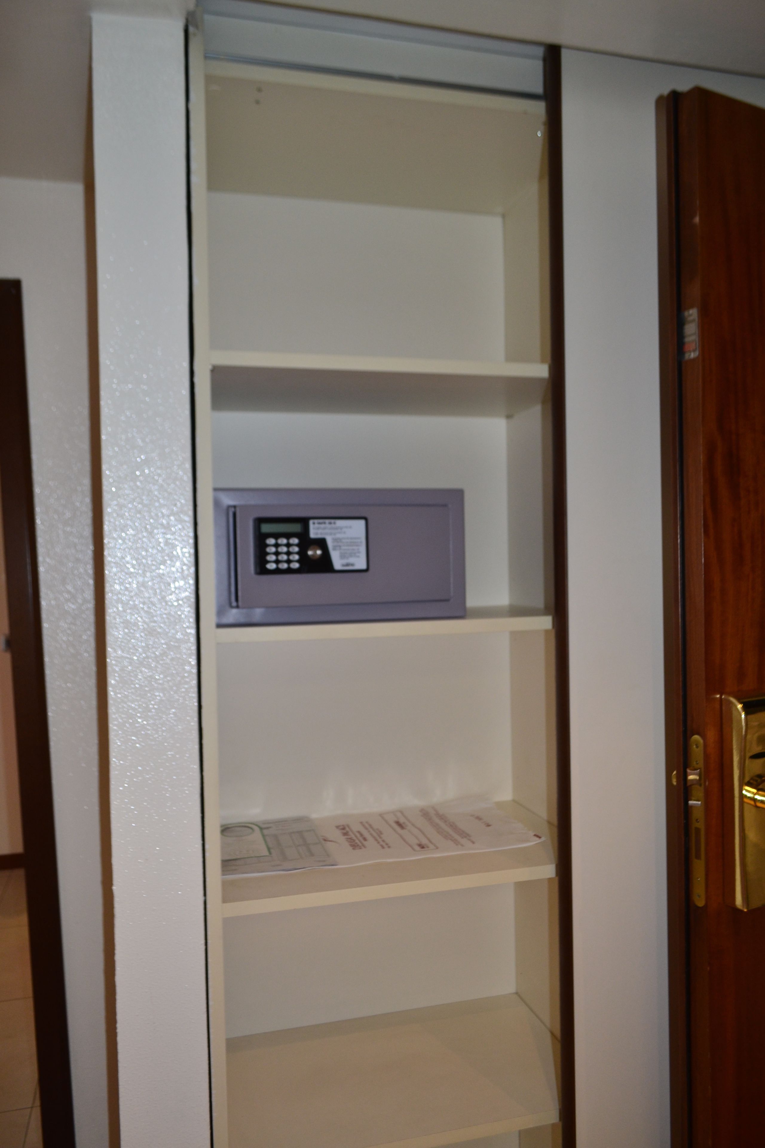 A closed door with a keypad lock.