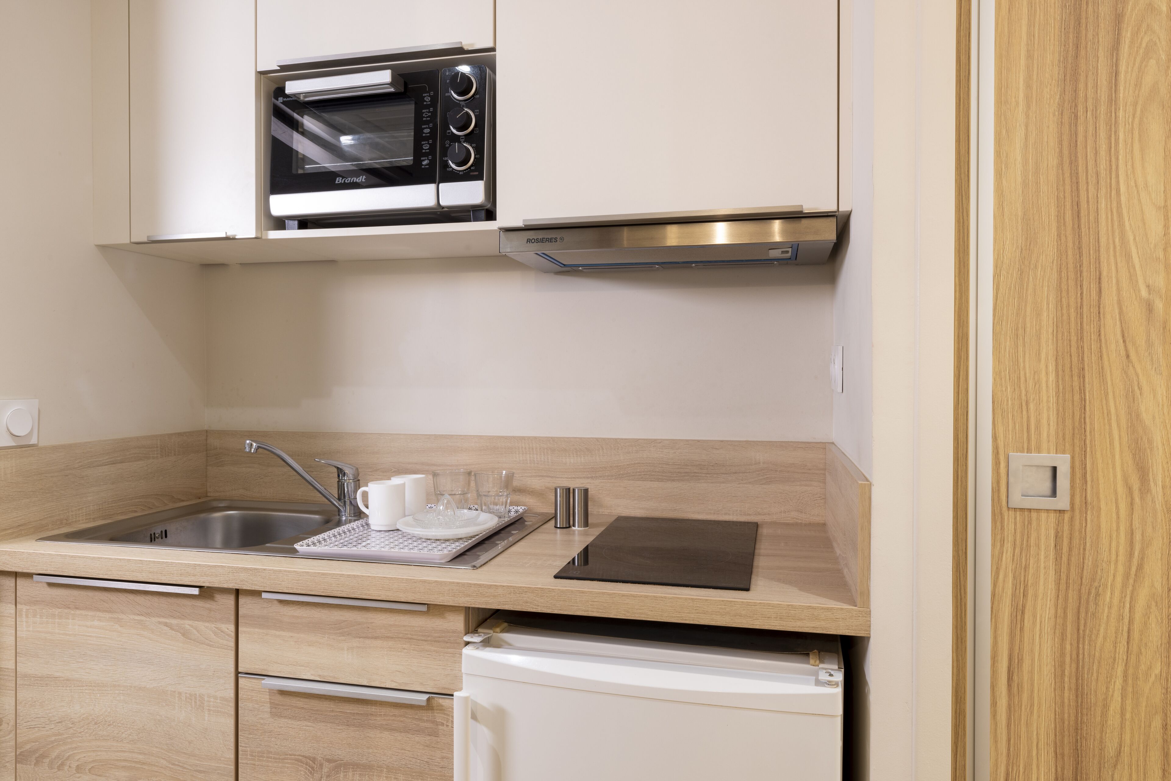 mini-fridge, stovetop, coffee/tea maker, electric kettle