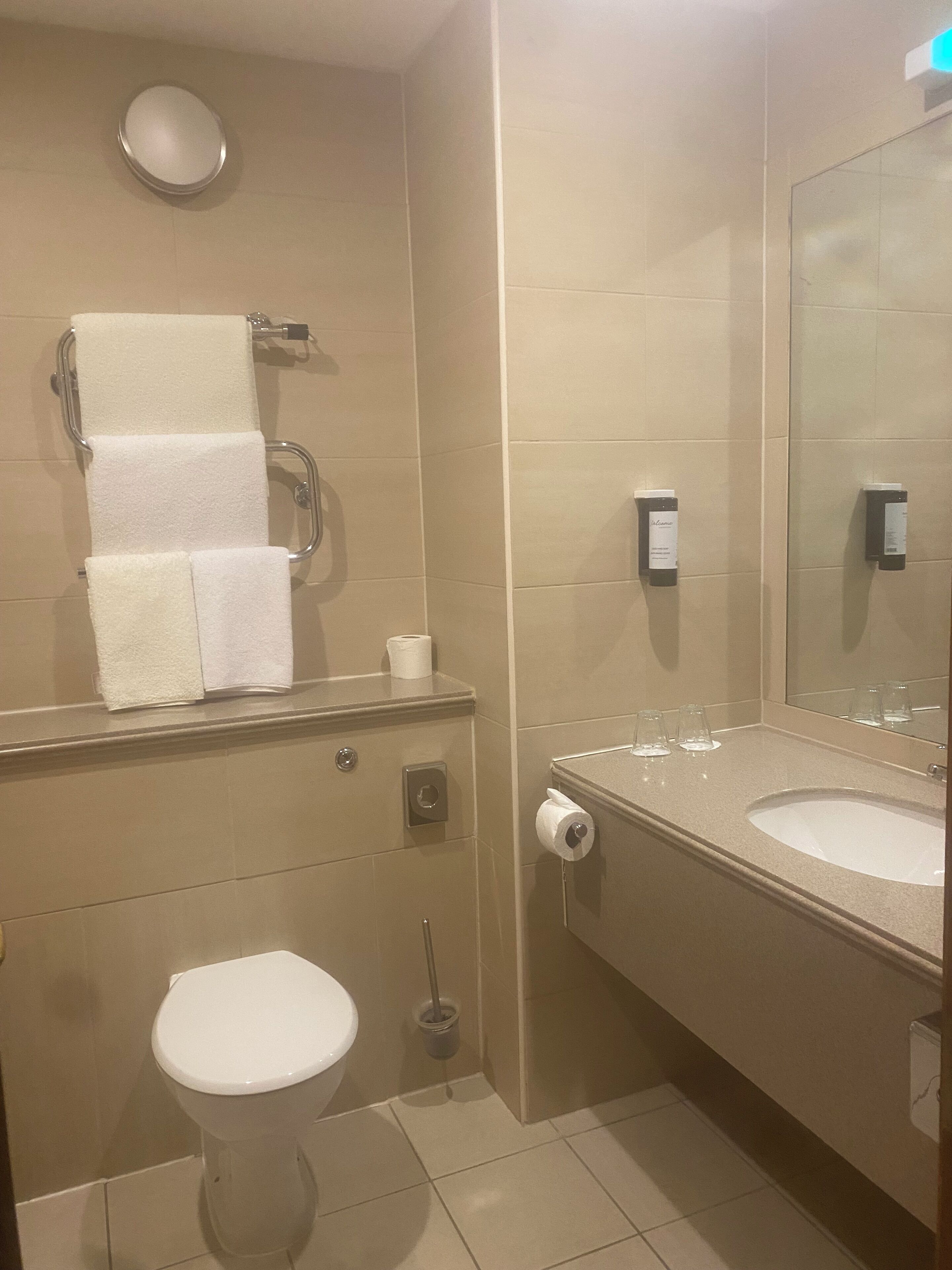 combined shower/bathtub, designer toiletries, hair dryer, towels