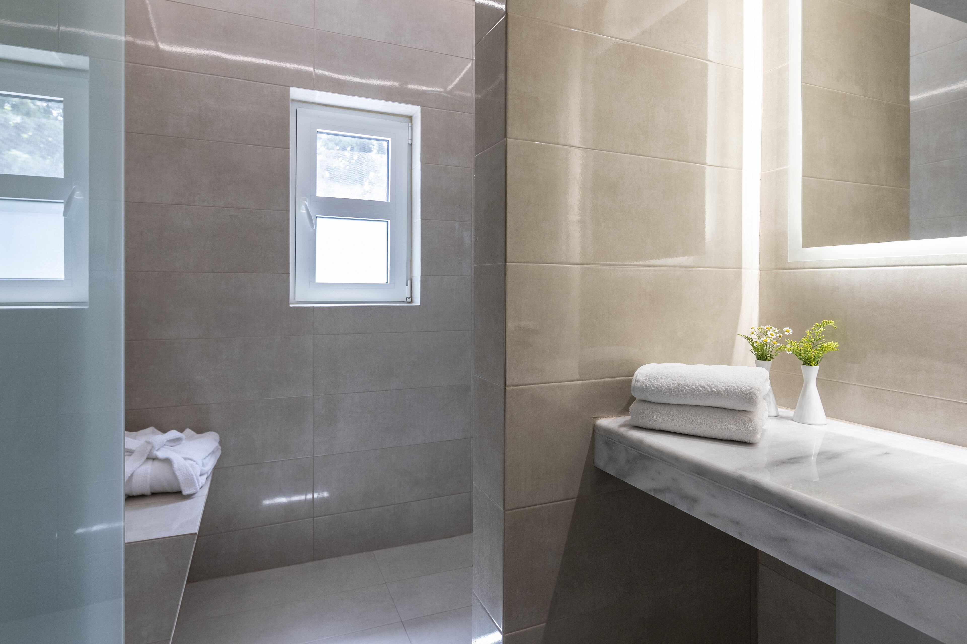 junior suite | bathroom | bathtub, free toiletries, hair dryer, slippers