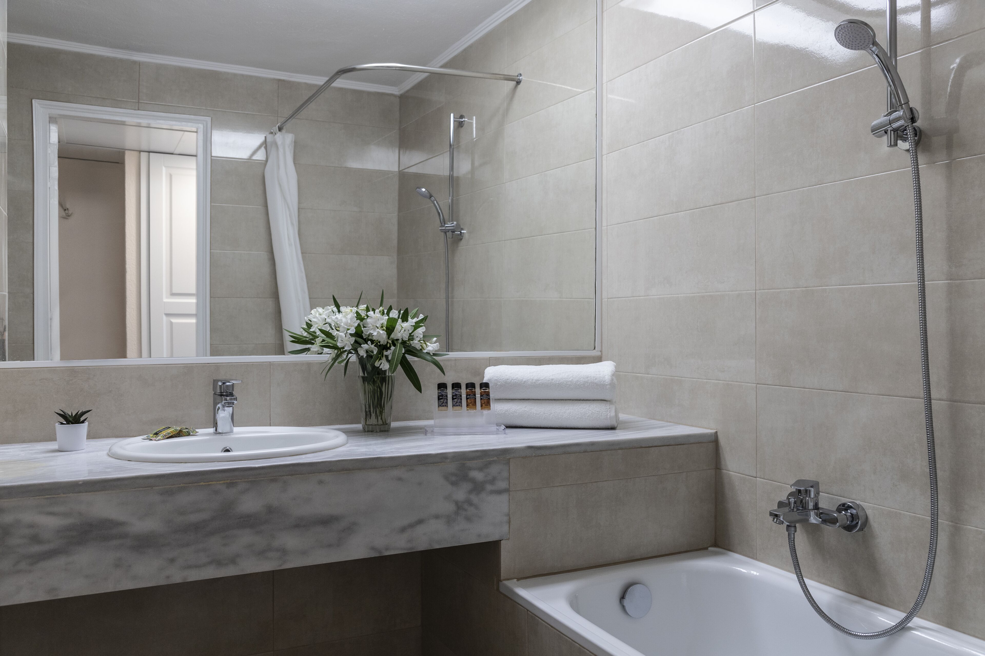 bathtub, free toiletries, hair dryer, slippers