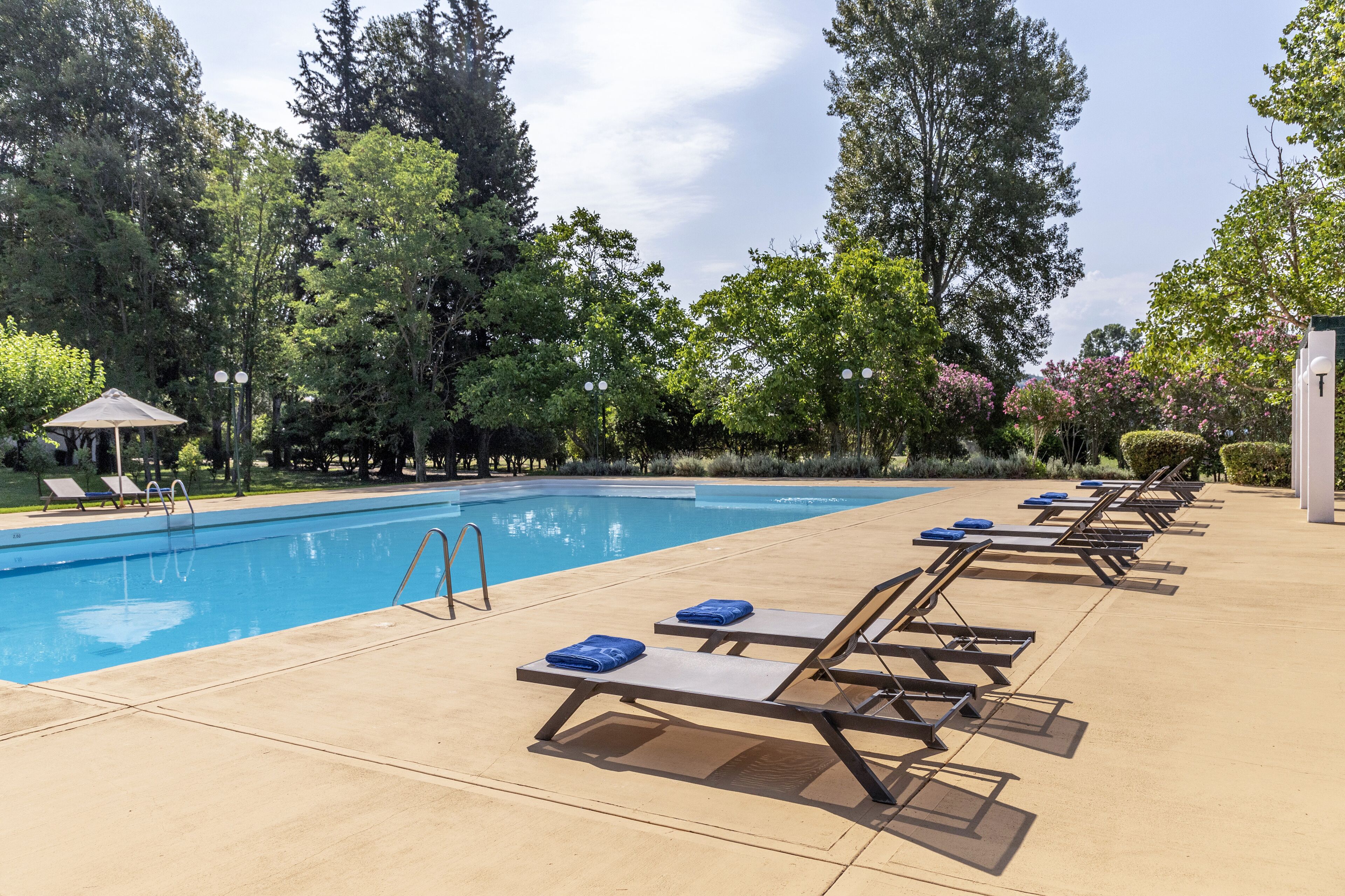 seasonal outdoor pool, pool umbrellas, pool loungers
