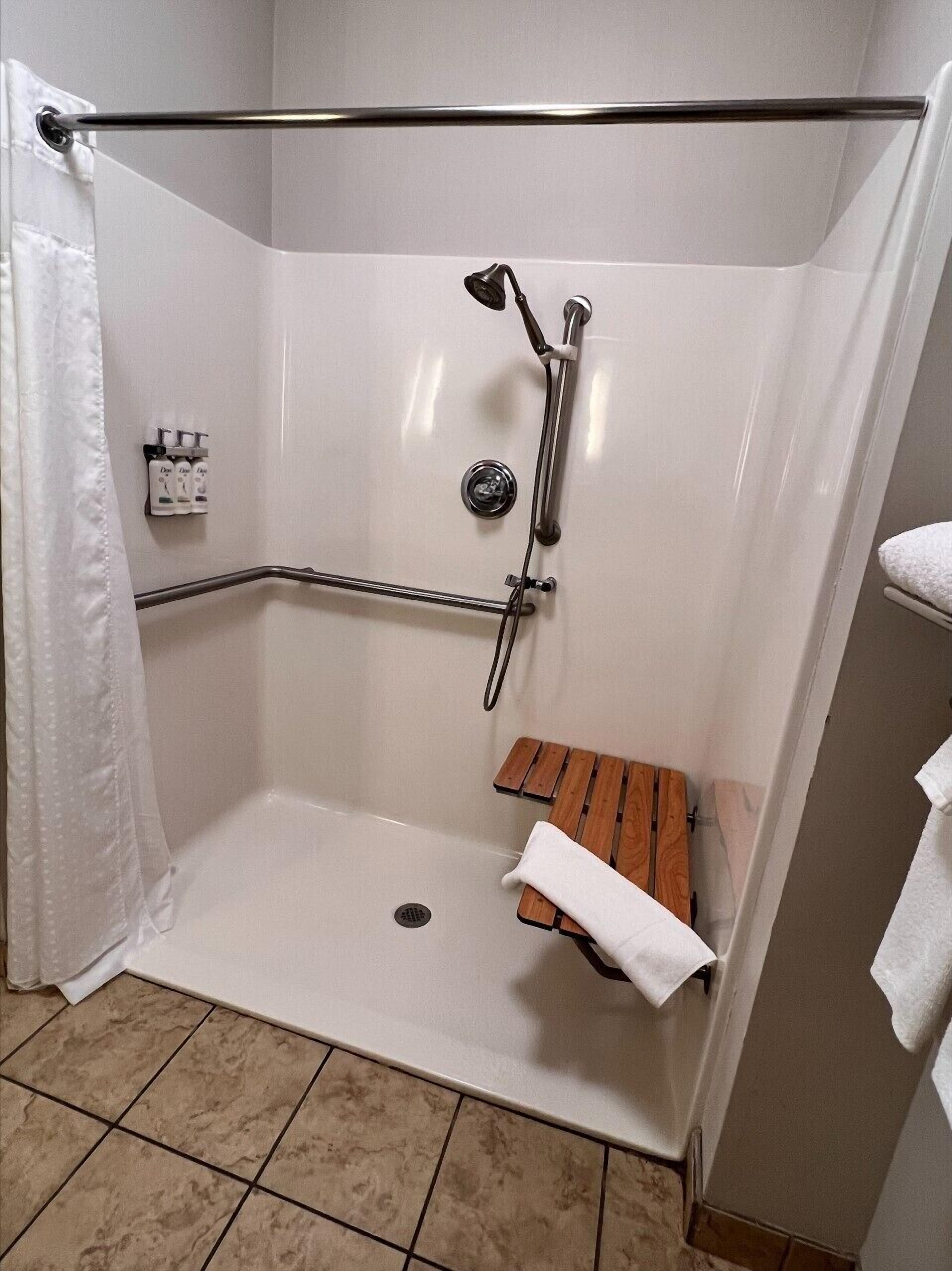 suite, 1 king bed with sofa bed, accessible (mobility, accessible tub) | bathroom | combined shower/bathtub, hair dryer, towels