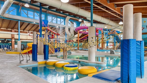 An indoor water park with a pool, slides, and play structures. - Big Horn Resort, an Ascend Collection Hotel (Billings)