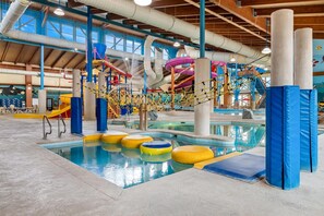 An indoor water park with a pool, slides, and play structures. - Big Horn Resort, an Ascend Collection Hotel (Billings)