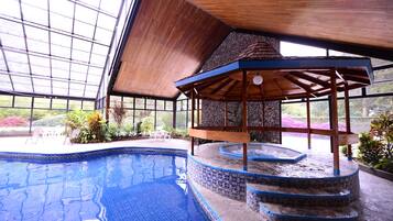 Indoor pool, open 8:00 AM to 10:00 PM, pool loungers