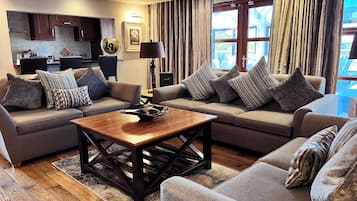 Premium Room | Living area | Flat-screen TV