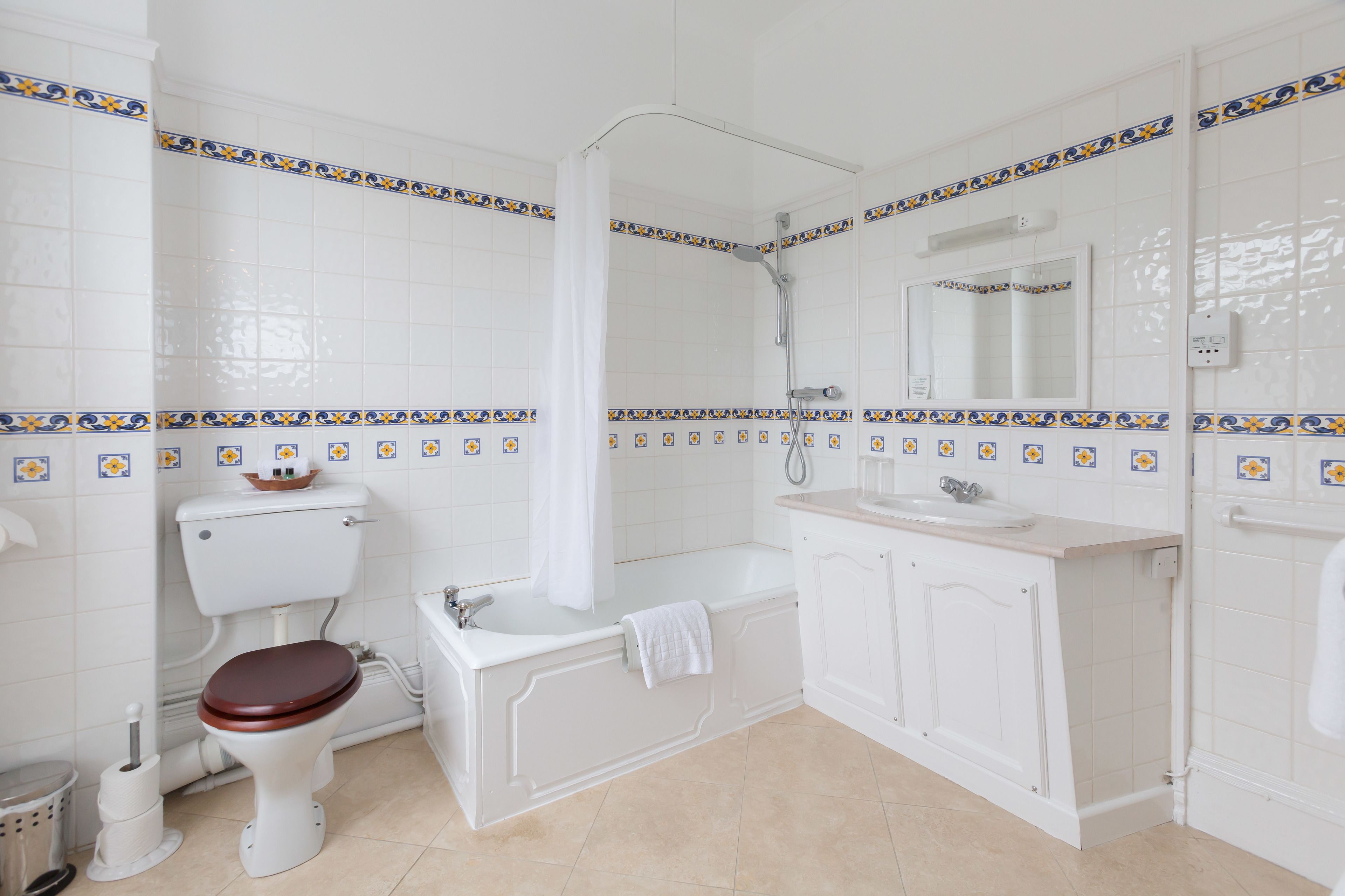 combined shower/bathtub, free toiletries, hair dryer, bathrobes