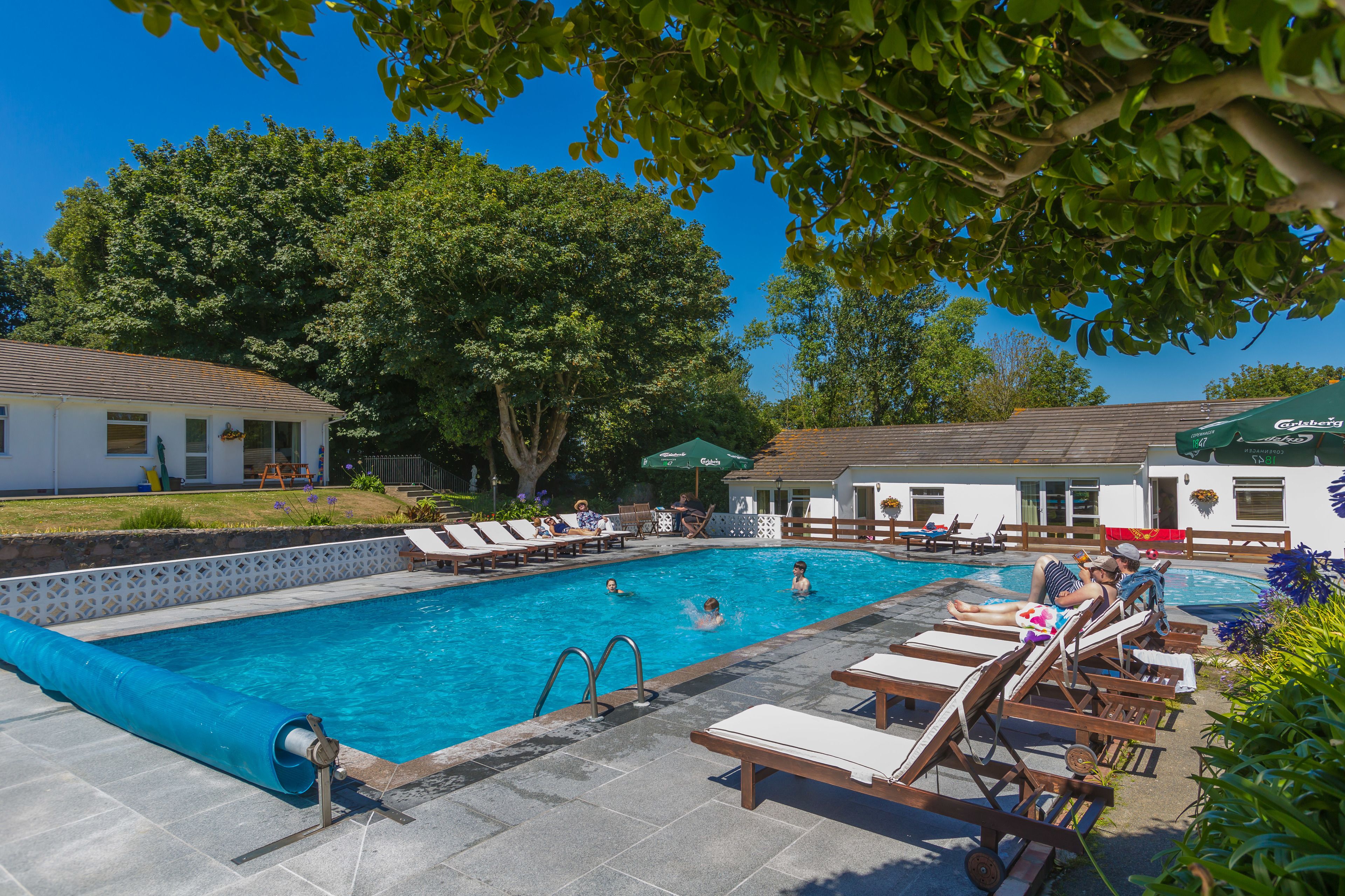 seasonal outdoor pool, open 8 am to 9 pm, pool loungers
