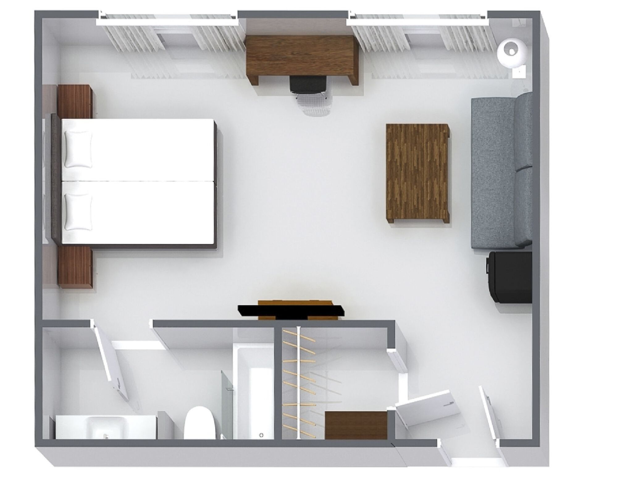 A floor plan of a hotel room with a bed, a sofa, a desk, a chair, a small table, a wardrobe, and a bathroom.