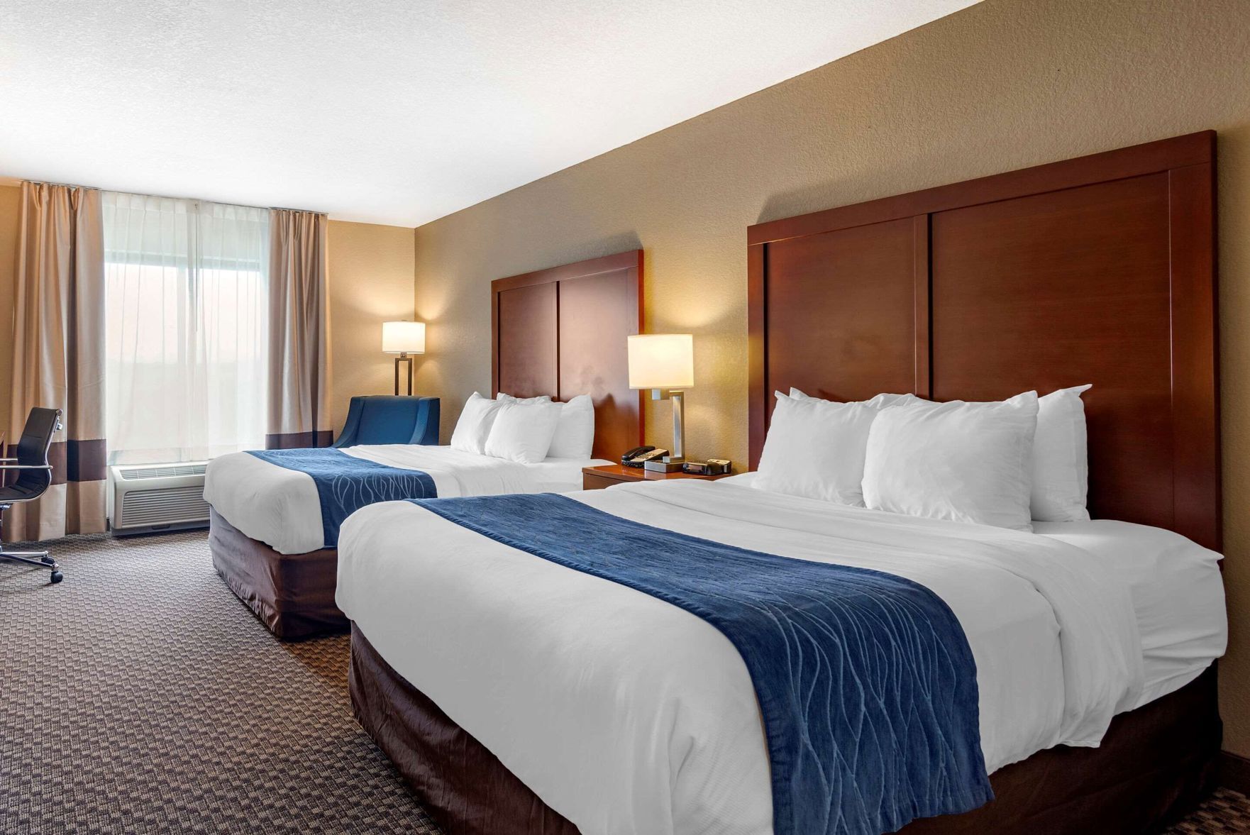 Desk, blackout drapes, iron/ironing board, free cribs/infant beds