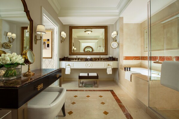 A bathroom with a large mirror, vanity, bathtub, and a glass shower enclosure. - The Venetian Macao (Cotai)