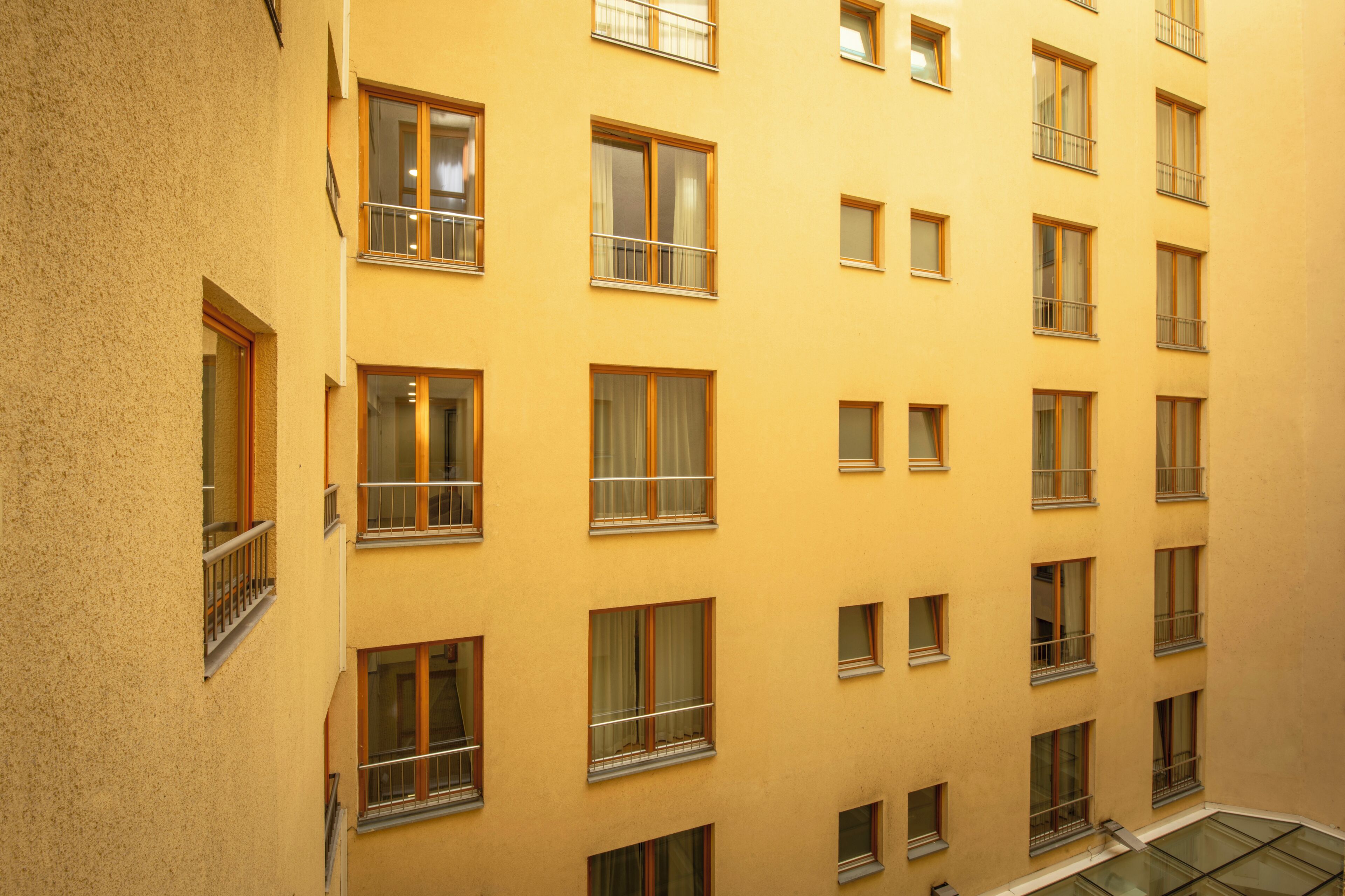 A multi-story building with numerous windows and balconies.