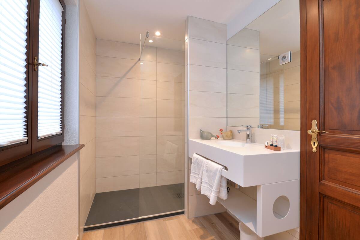 superior double room | bathroom | hair dryer, towels, soap, shampoo
