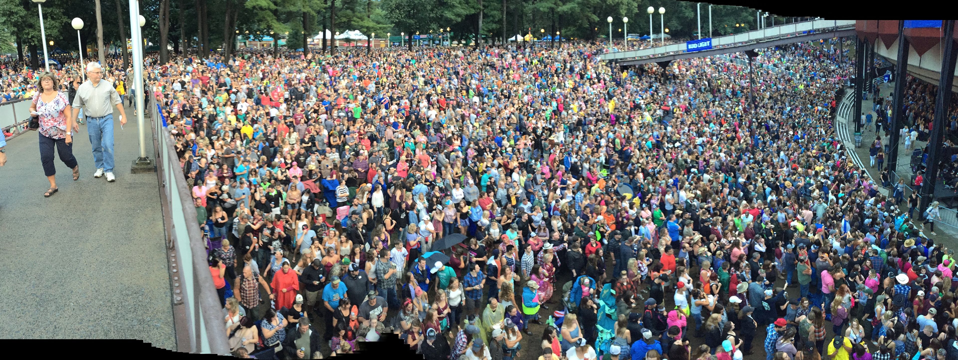 A large crowd of people gathered in an outdoor public space.