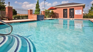 Outdoor pool, open 9 AM to 10 PM, pool loungers