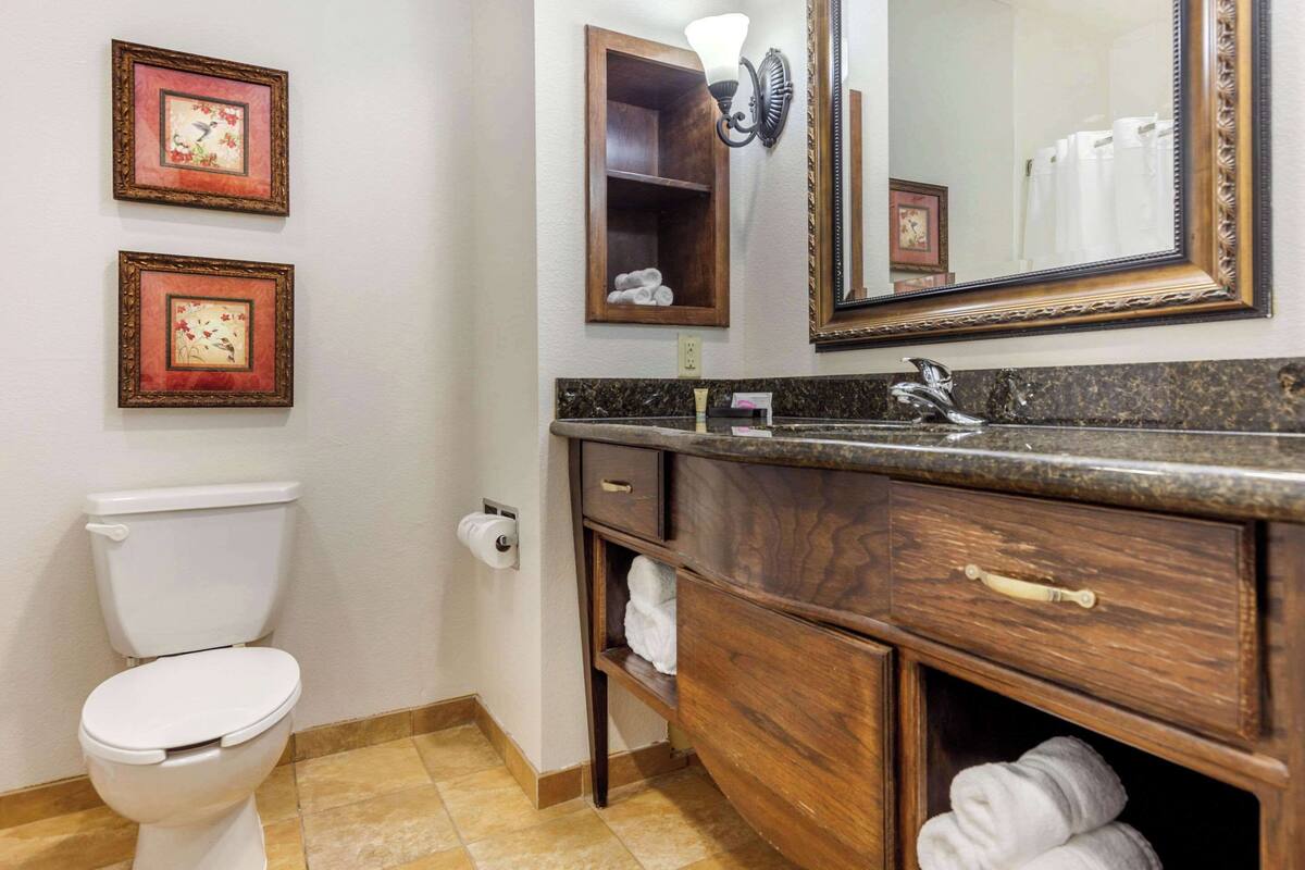 premium bedding, pillow-top beds, desk, laptop workspace