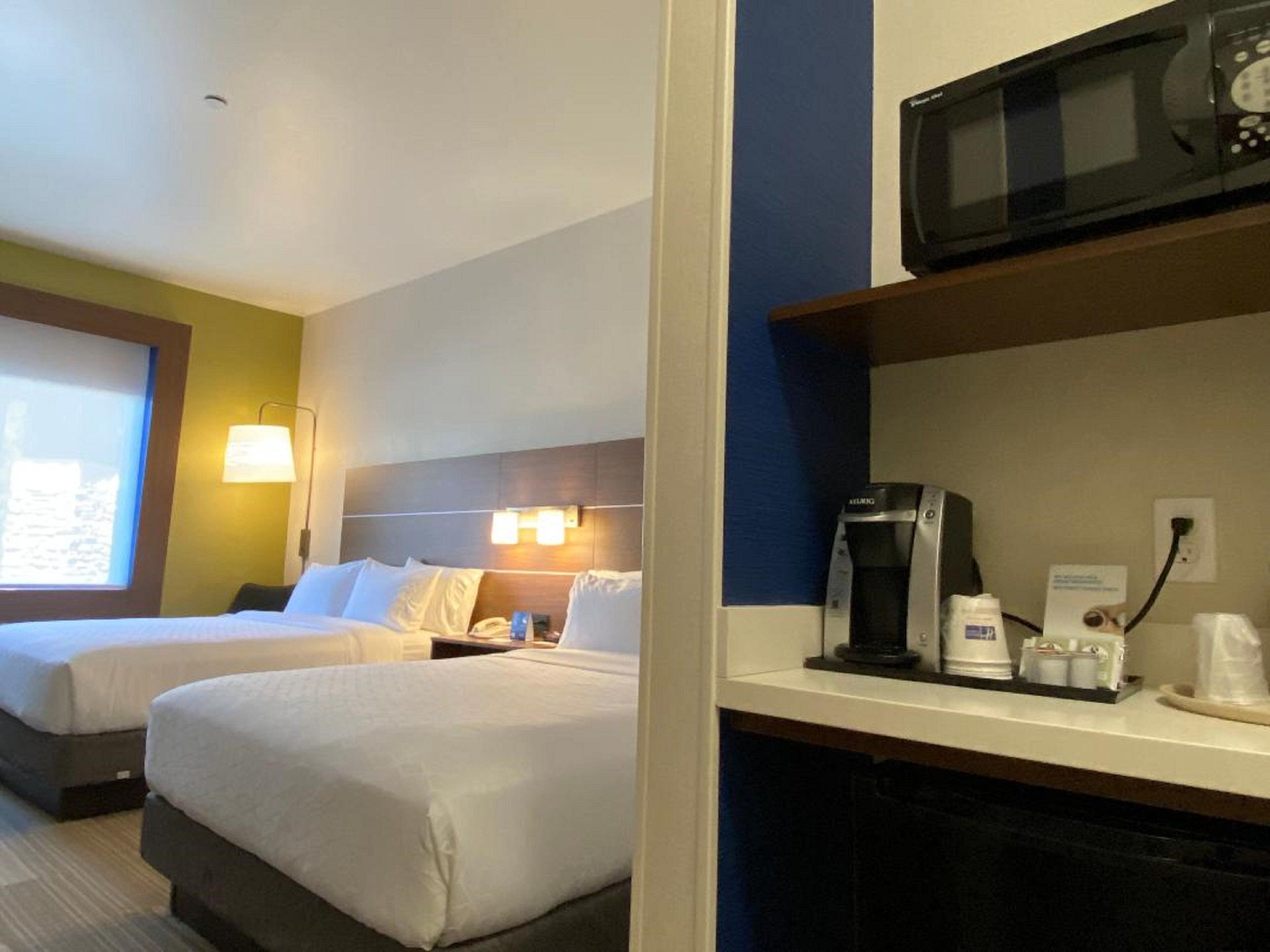 standard room, 2 queen beds | in-room safe, iron/ironing board, free cots/infant beds, free wifi