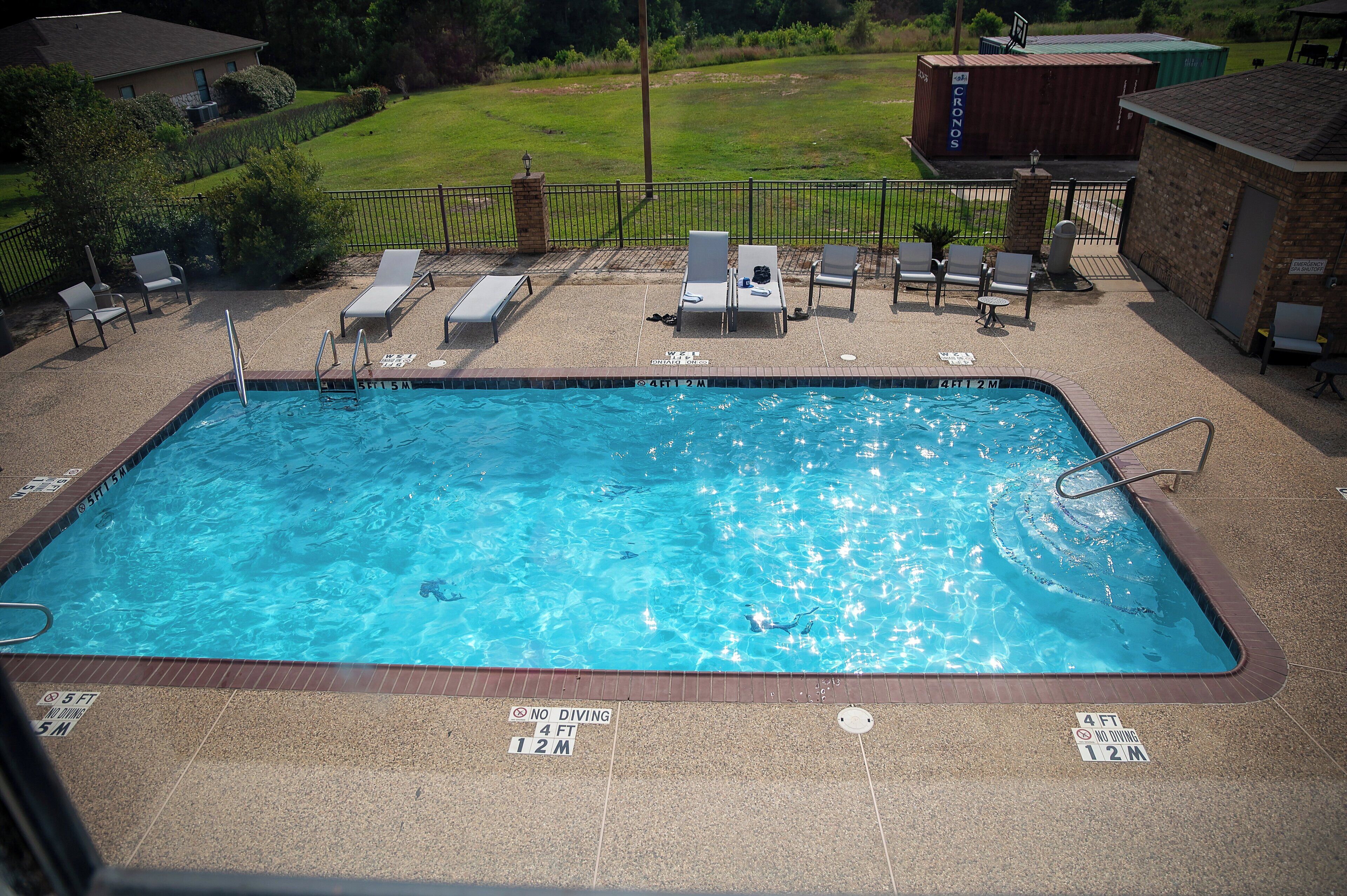 seasonal outdoor pool, open 9 am to 10 pm, pool loungers
