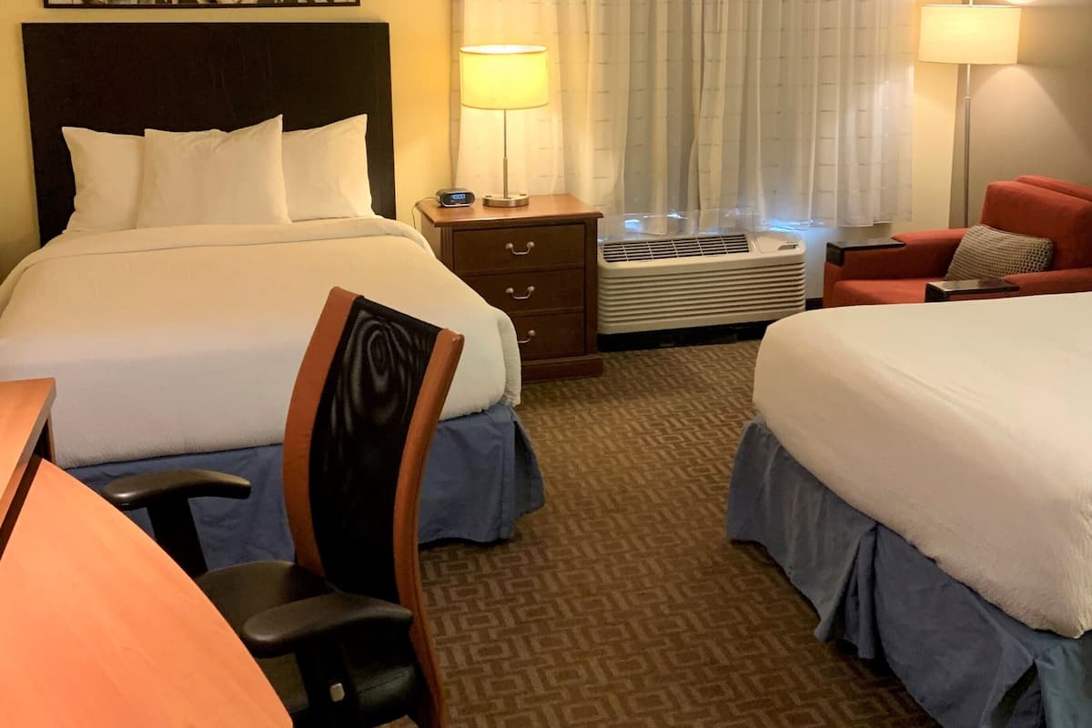 premium bedding, pillow-top beds, desk, laptop workspace