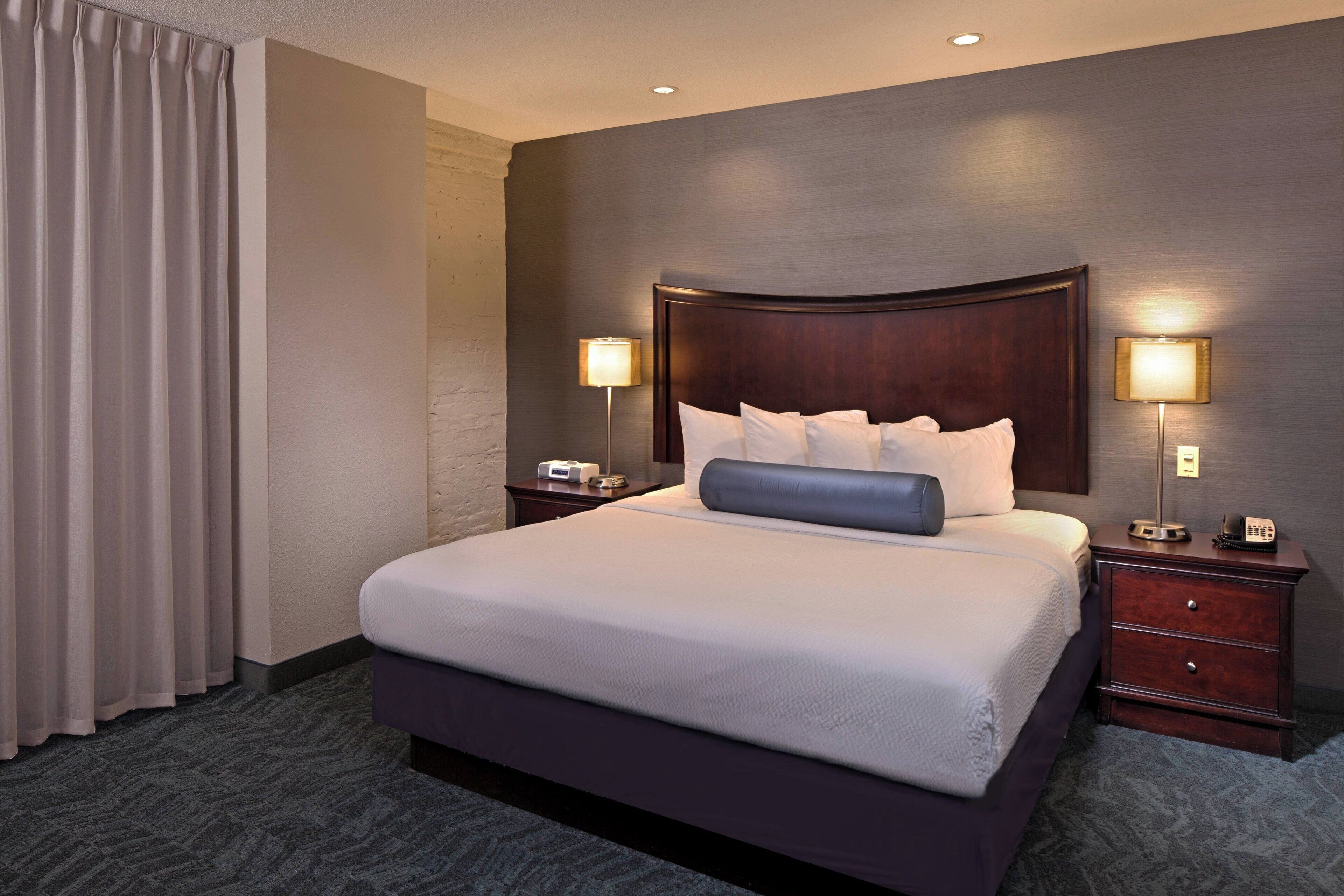 premium bedding, desk, blackout curtains, iron/ironing board