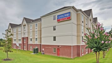 A multi-story hotel with a sign for Candlewood Suites.