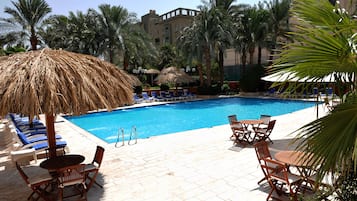 Outdoor pool, open 9 AM to 7 PM, free pool cabanas, pool umbrellas
