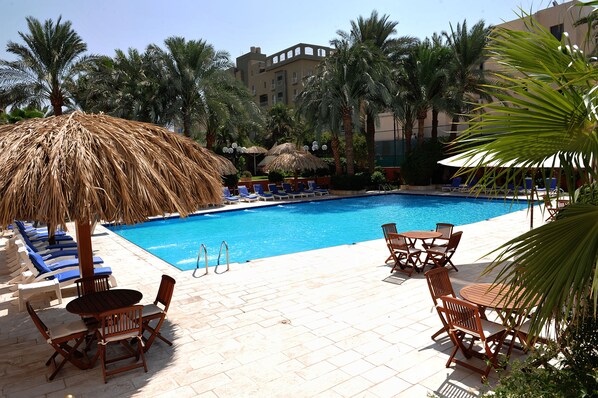 Outdoor pool, open 9 AM to 7 PM, free cabanas, pool umbrellas