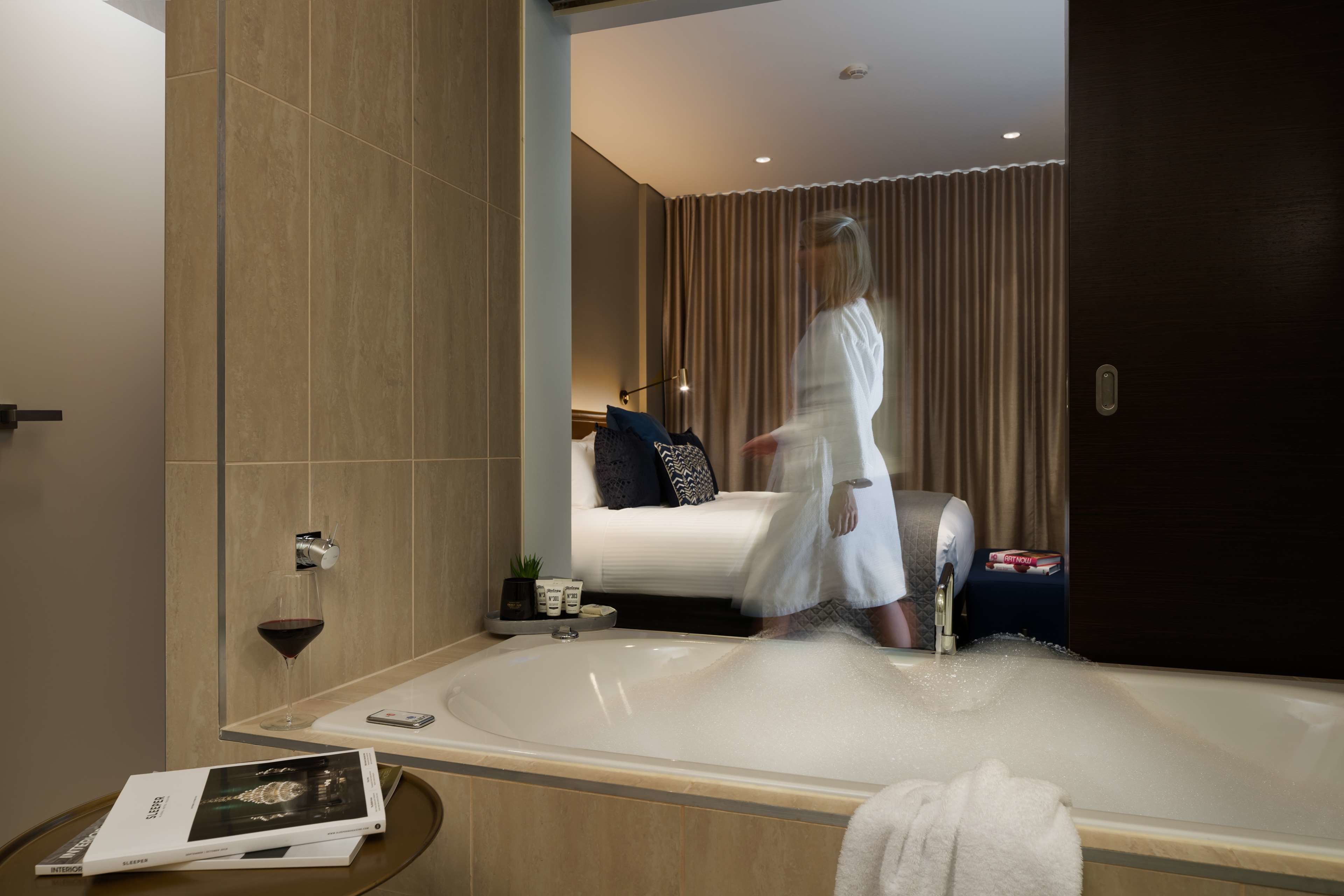 executive spa room | bathroom | shower, eco-friendly toiletries, hair dryer, towels