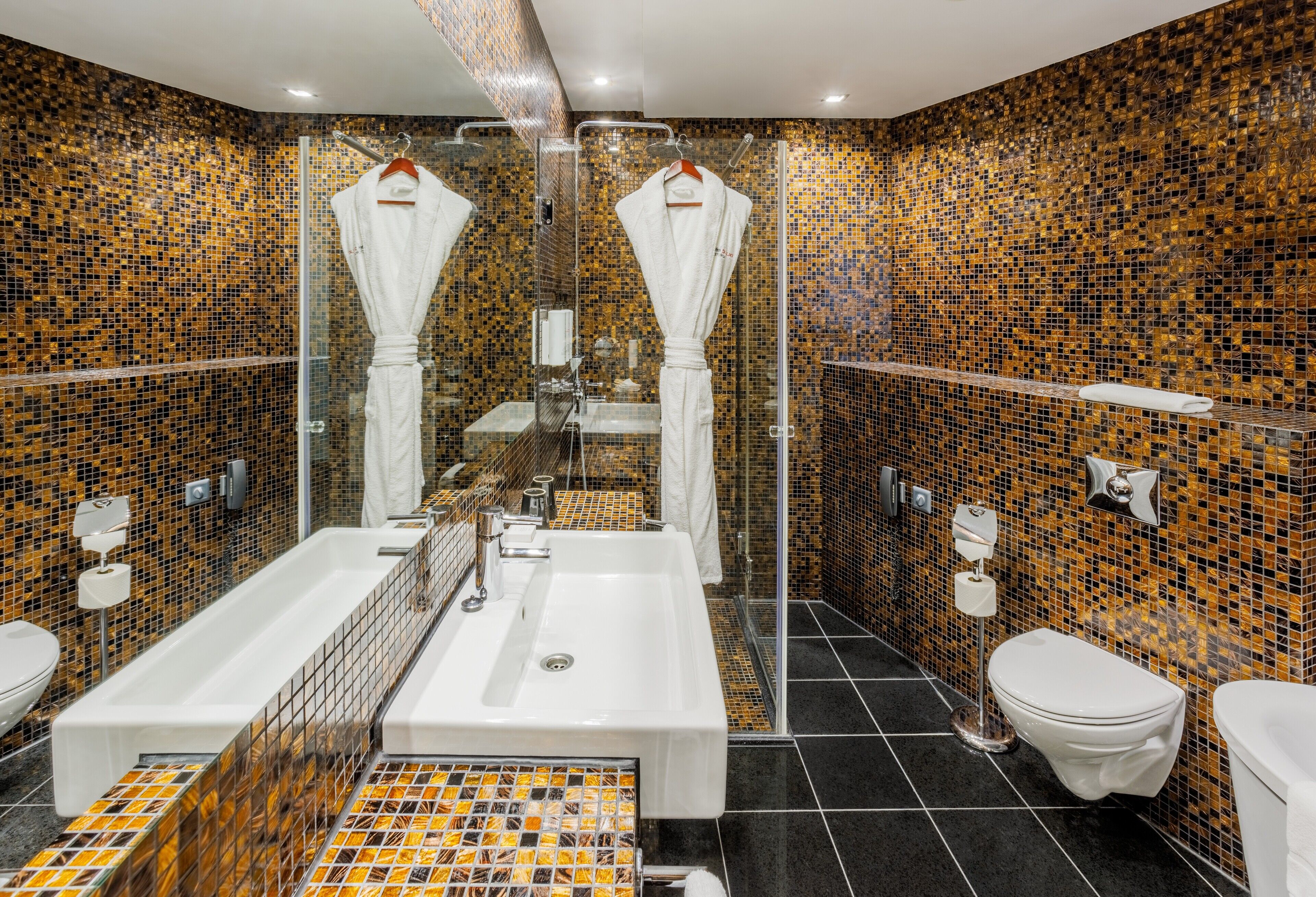 designer toiletries, hair dryer, bathrobes, slippers