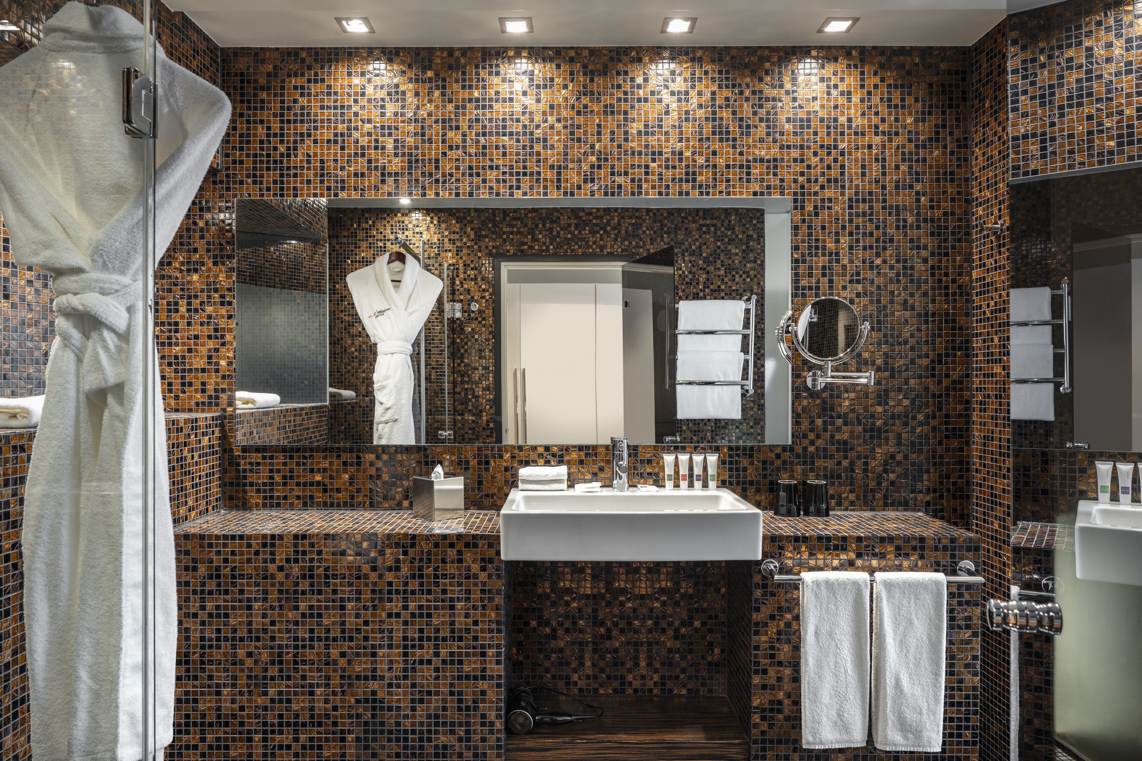 designer toiletries, hair dryer, bathrobes, slippers