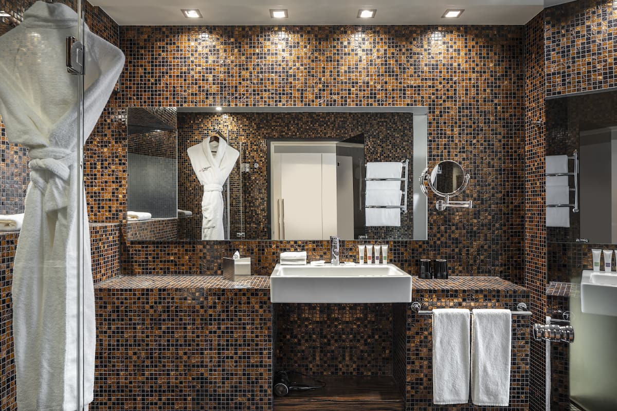 designer toiletries, hair dryer, bathrobes, slippers