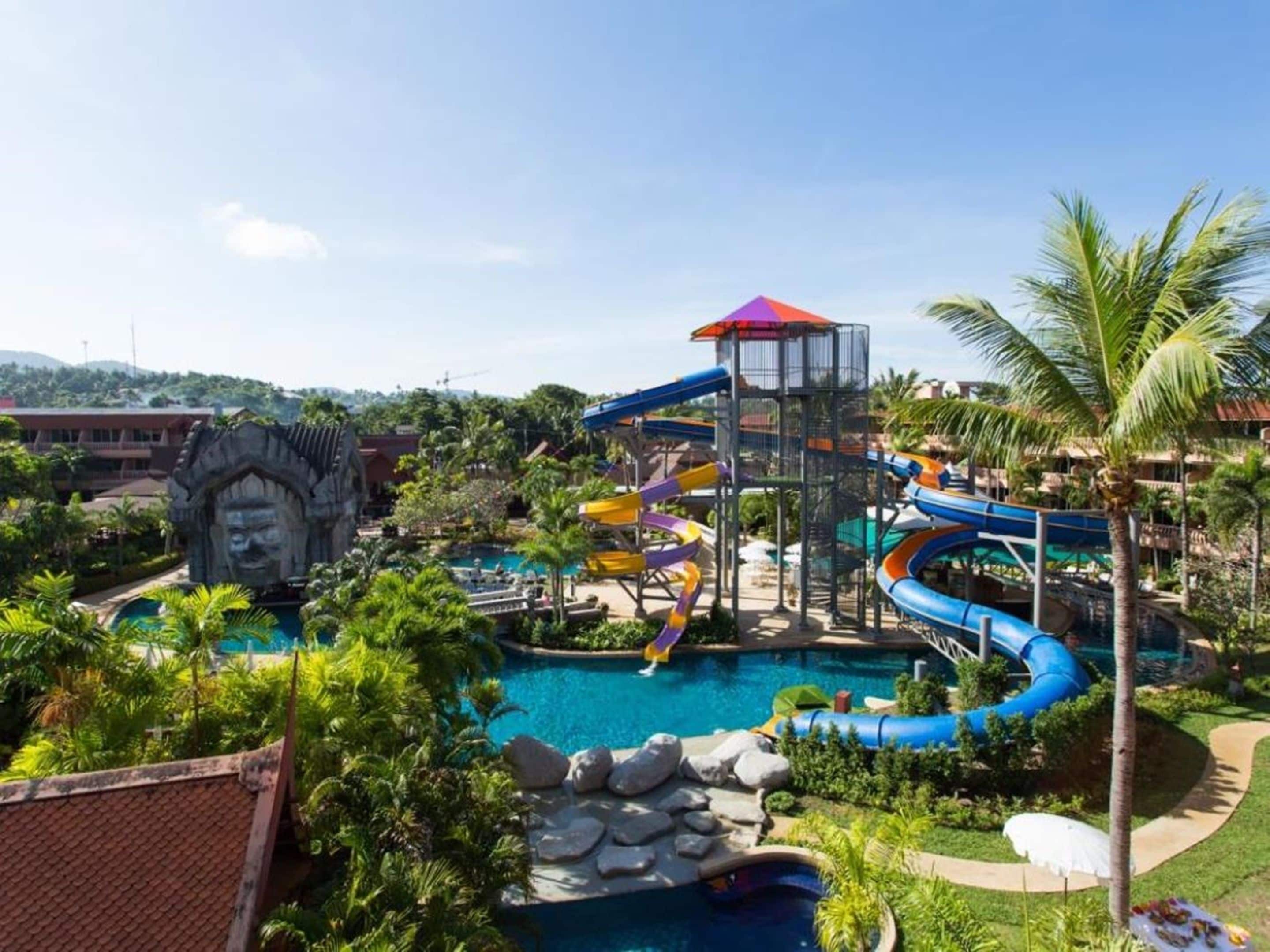 A water park with multiple slides and a large pool.