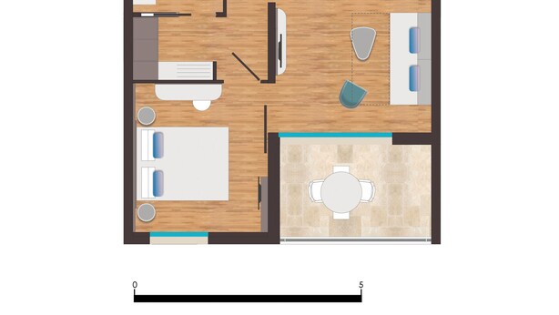A floor plan of a hotel room with a bed, a desk, a chair, a small table, and a bathroom.