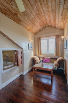 Studio Suite, 1 King Bed, Garden View | Minibar, desk, laptop workspace, iron/ironing board at A Stones Throw Away