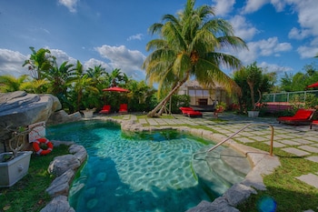 Outdoor pool, sun loungers at A Stones Throw Away