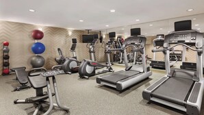 A gym with treadmills, elliptical machines, and free weights. - Residence Inn by Marriott Newport/Middletown (Middletown)