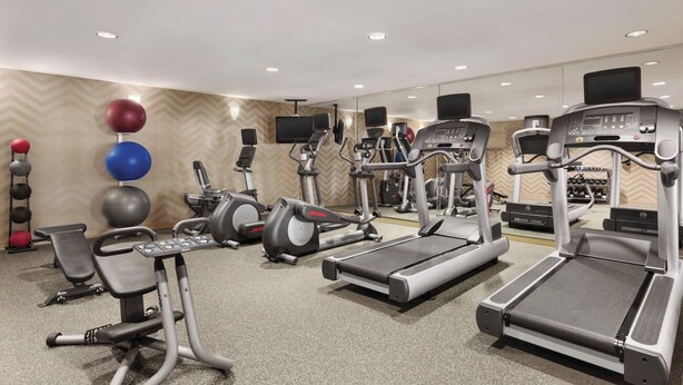 A gym with treadmills, elliptical machines, and free weights. - Residence Inn by Marriott Newport/Middletown (Middletown)