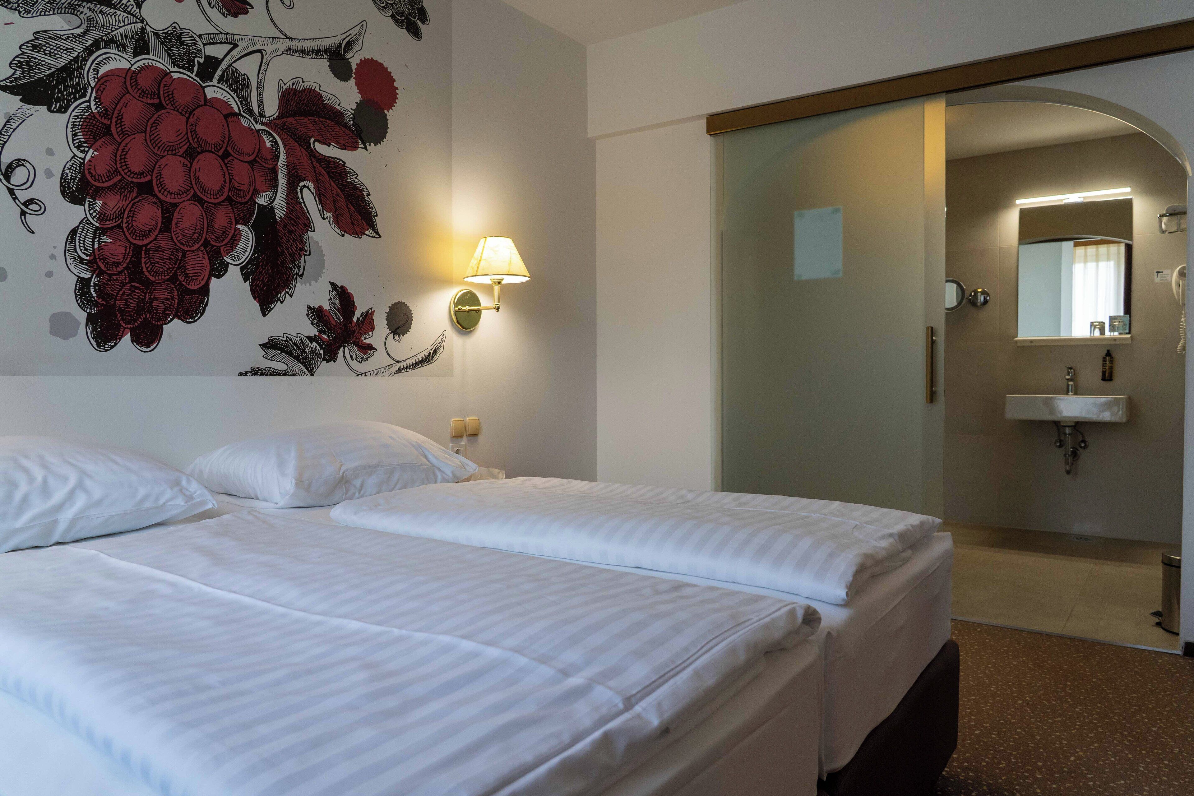 standard suite | in-room safe, desk, blackout curtains, iron/ironing board