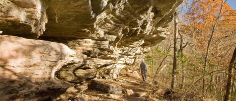 A natural rock formation with a narrow passageway.