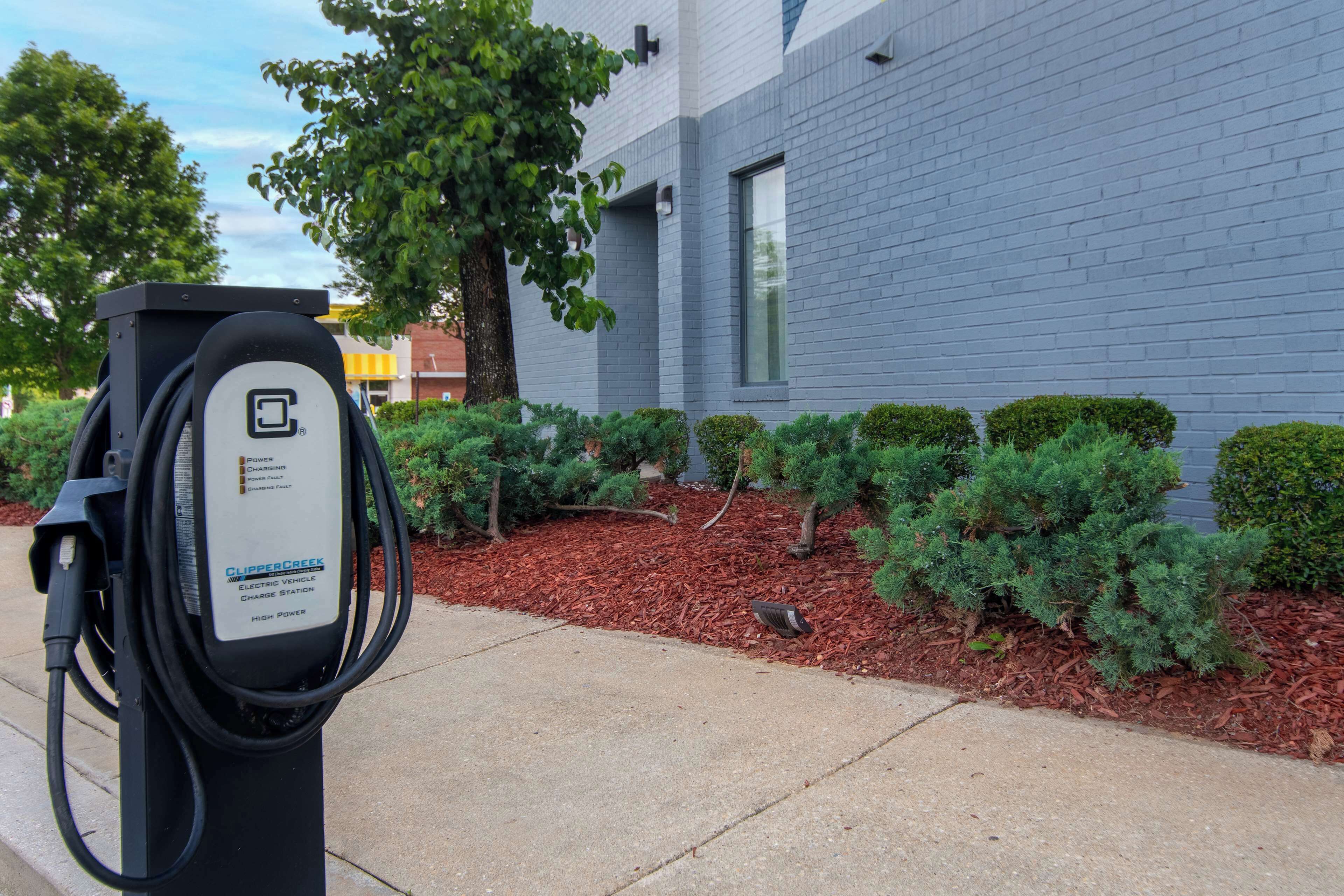 An electric vehicle charging station with a label indicating it is a high-power station.