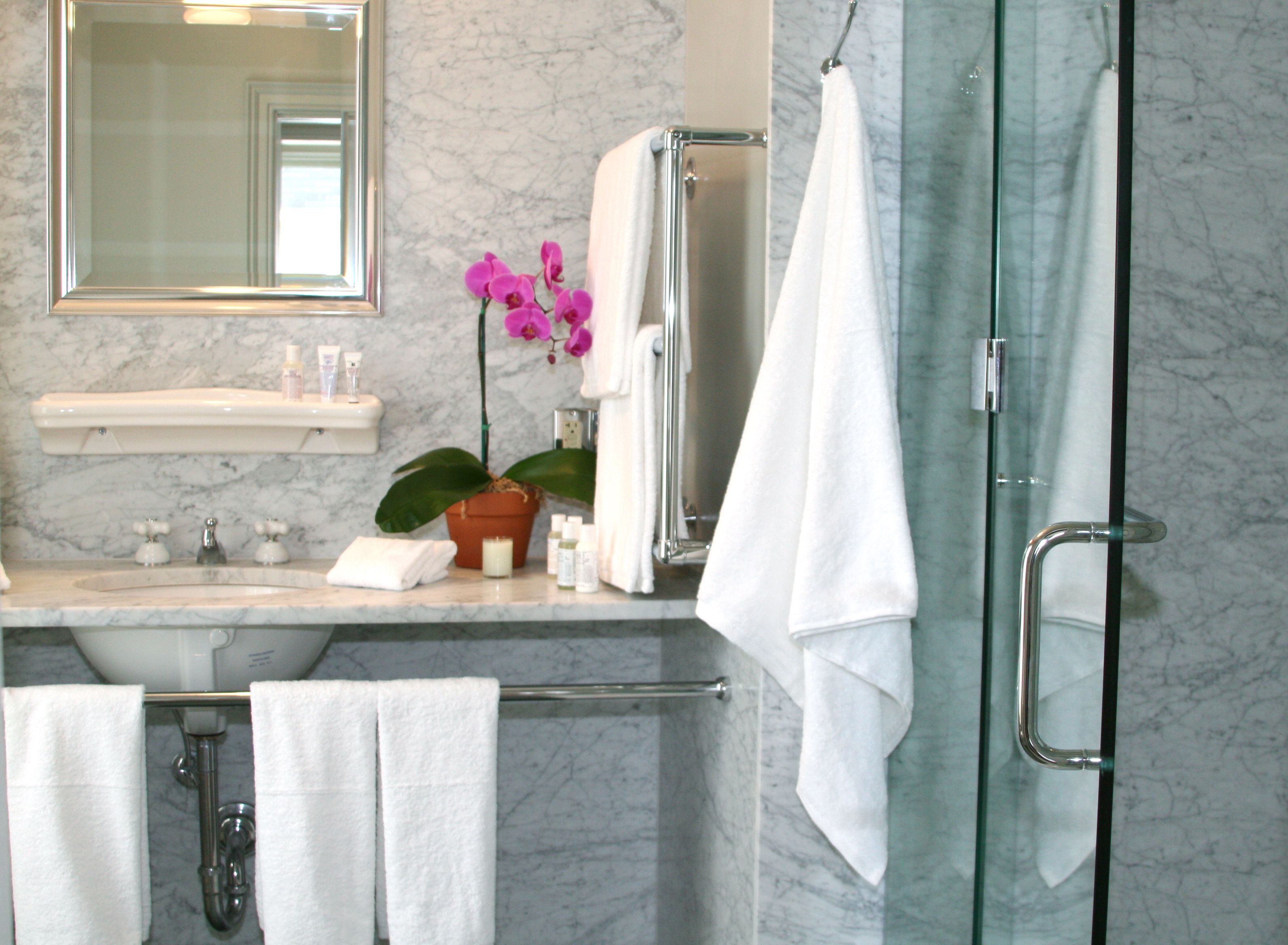 deep-soaking bathtub, rainfall showerhead, designer toiletries