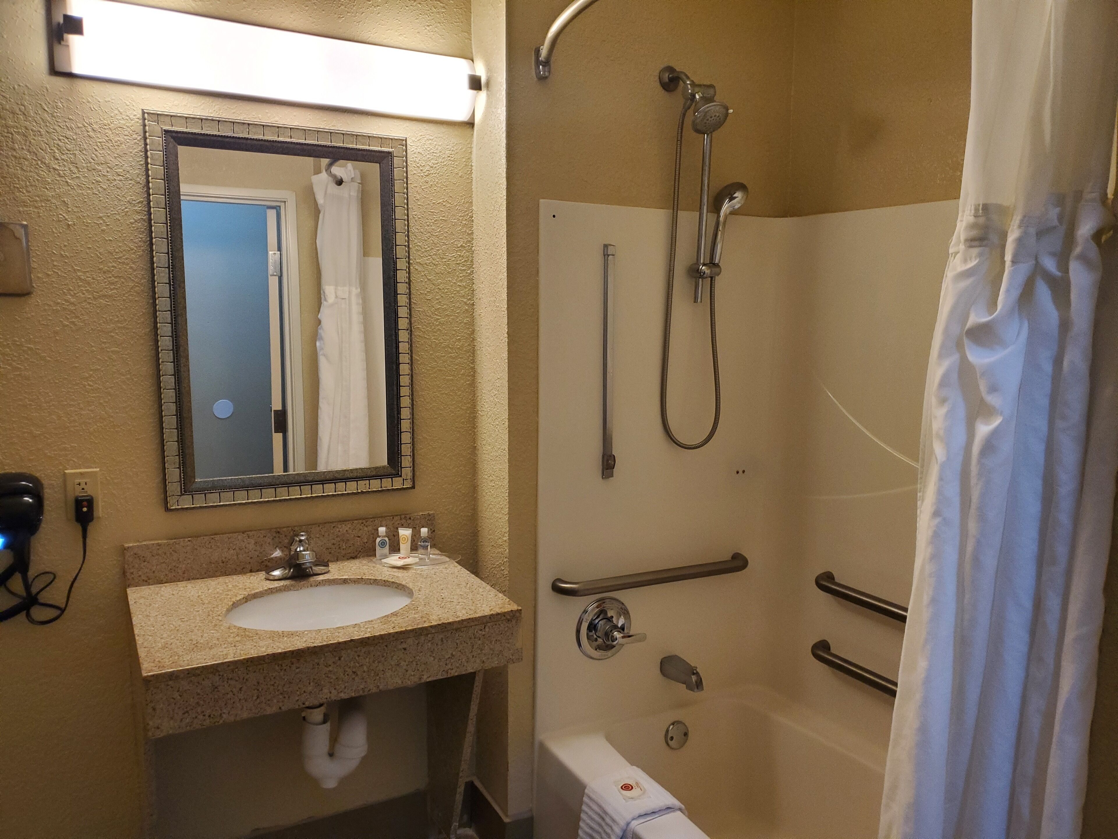 combined shower/bathtub, free toiletries, hair dryer, towels
